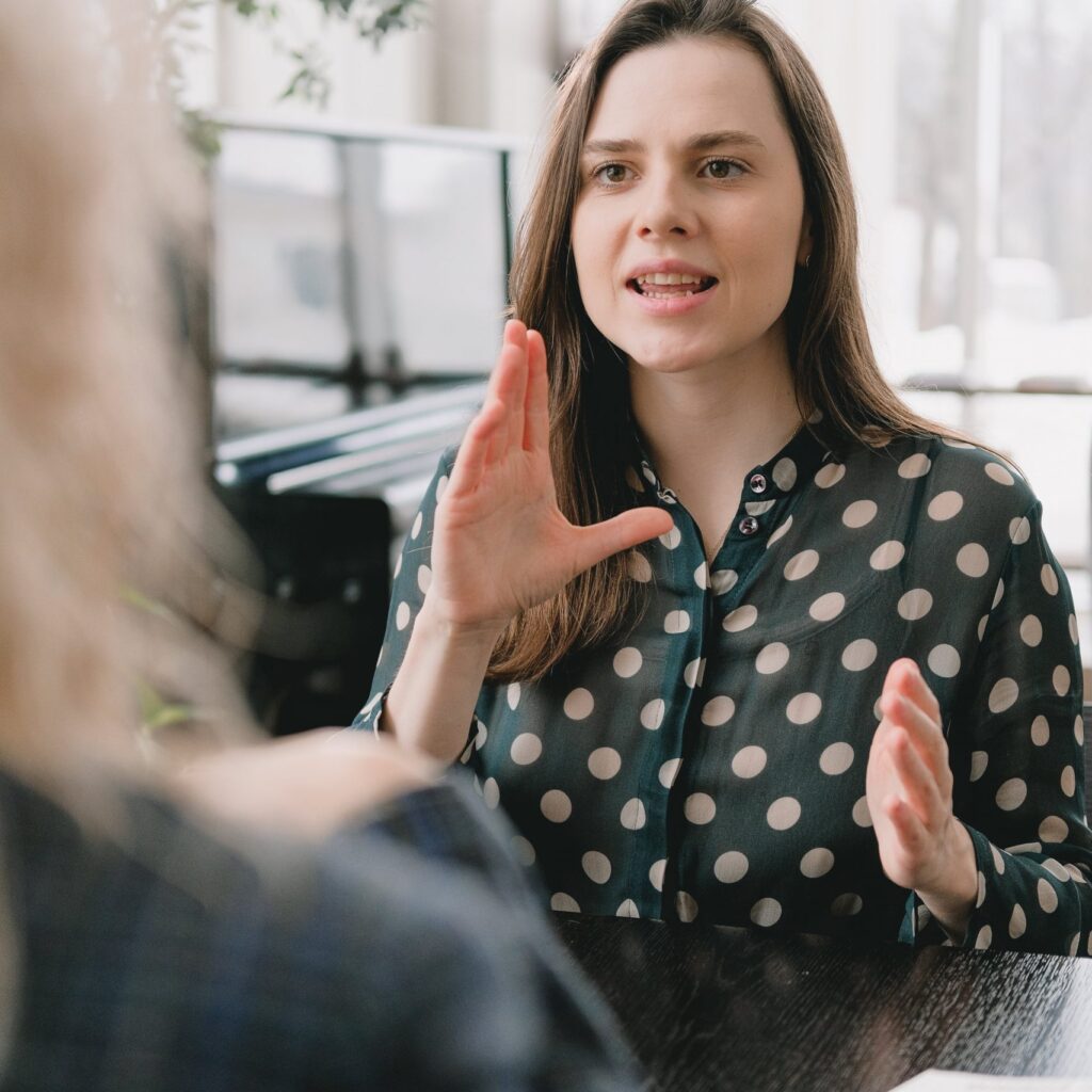 student discusses english language course with teacher